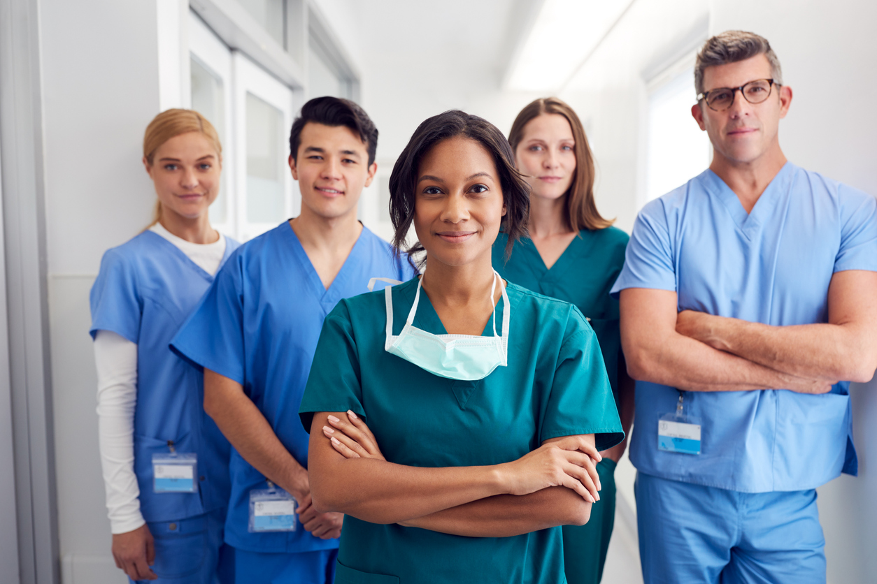 group of hospital colleagues standing together and smiling
